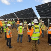 people infront of solar panel